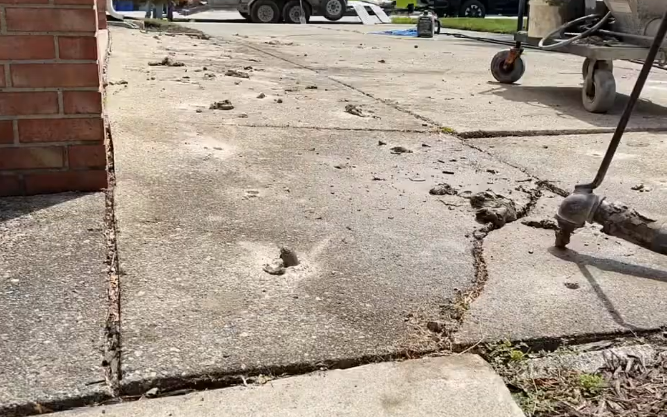 Mudjacking before and after - sunken concrete driveway lifted and leveled in Pocatello, ID